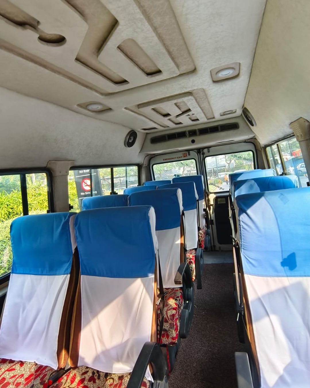 interior look of an AC tempo traveller for rent in bangalore affordable pricing