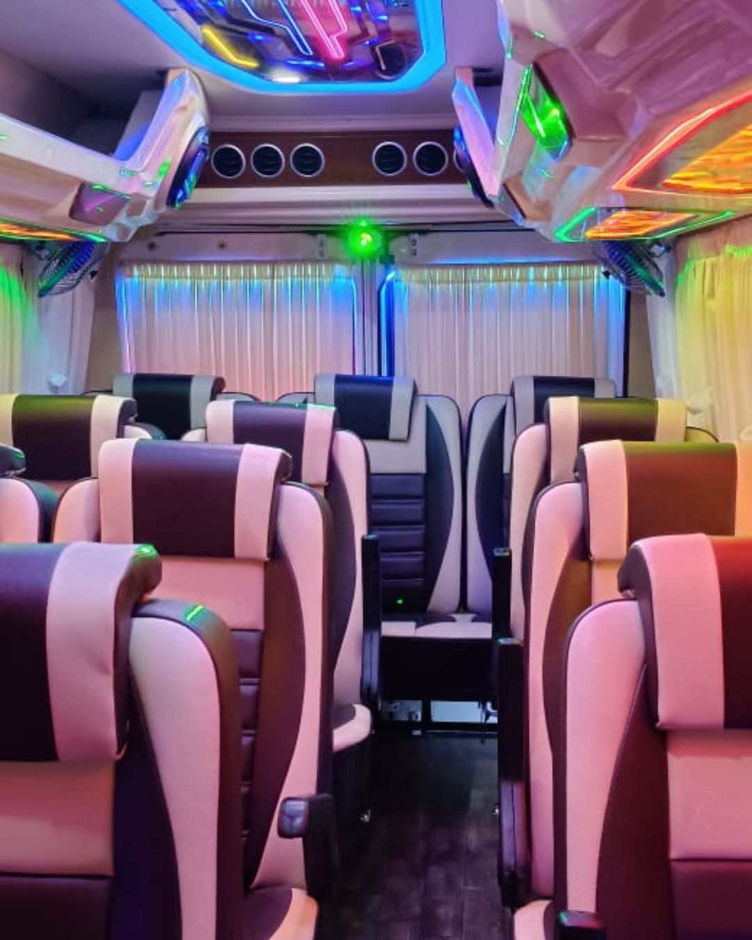 Book the Deluxe tempo traveller for rent in bangalore with lights and sound system in it